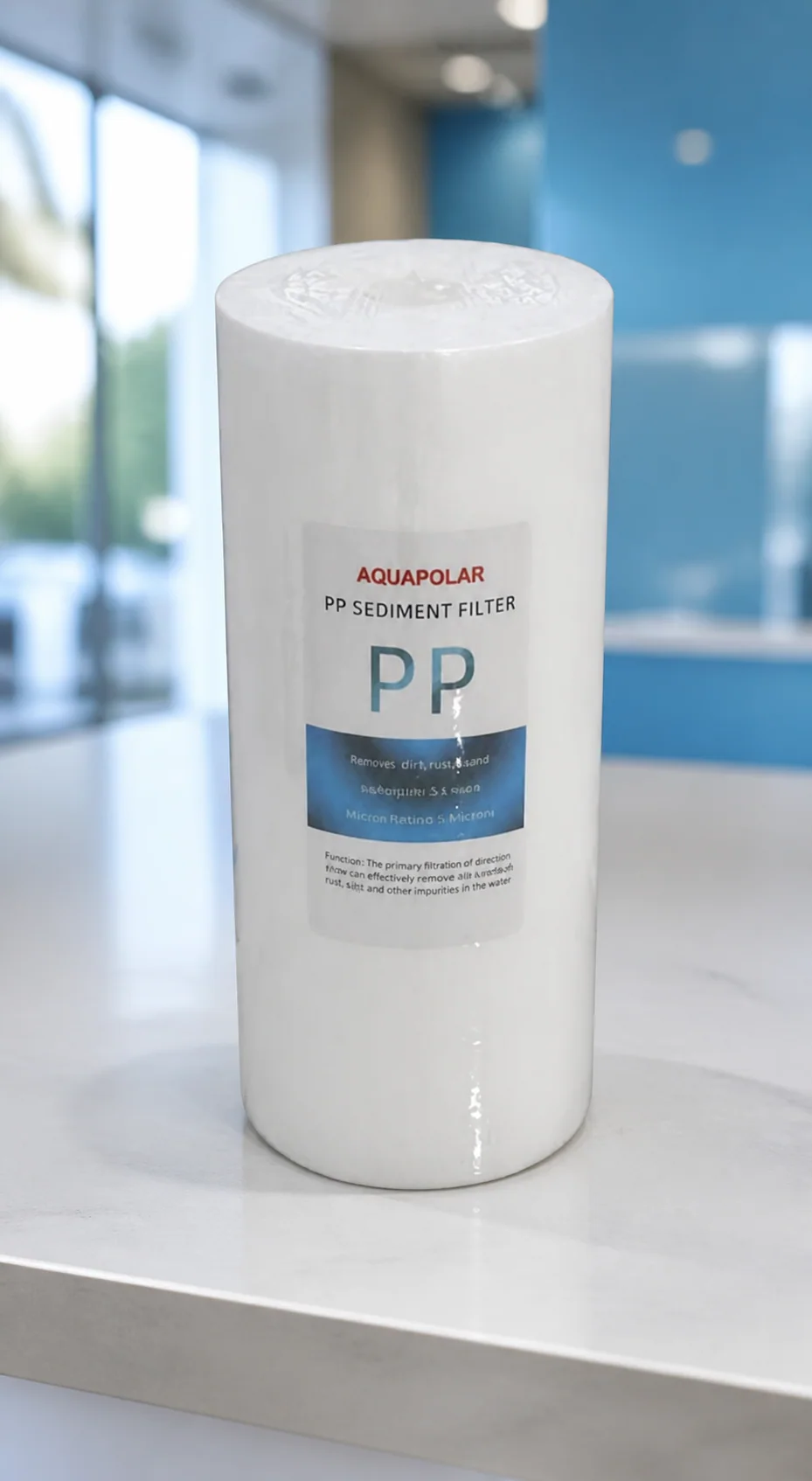 AQUAPOLAR 10-inch PP sediment filter in a clean showroom scene